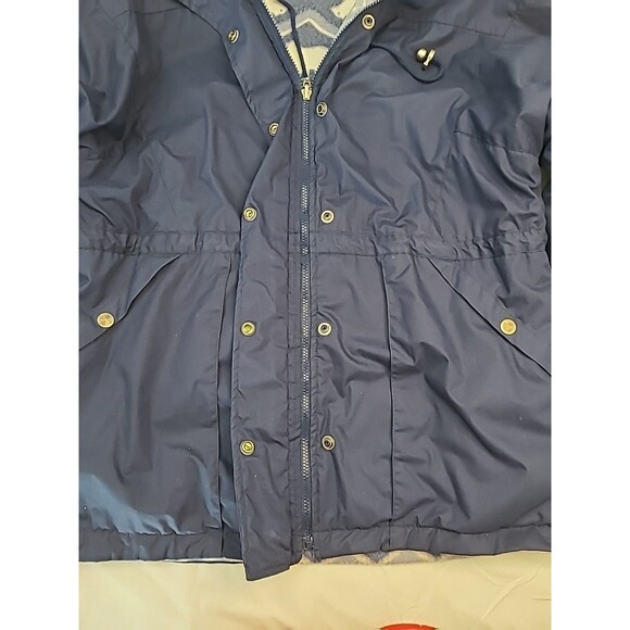 navy blue hooded anorak rain jacket with a polar bear print fleece lining. - Picture 4 of 6